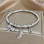 Charm Bangle with Bow and Heel Pendants