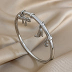 Charm Bangle with Bow and Heel Pendants