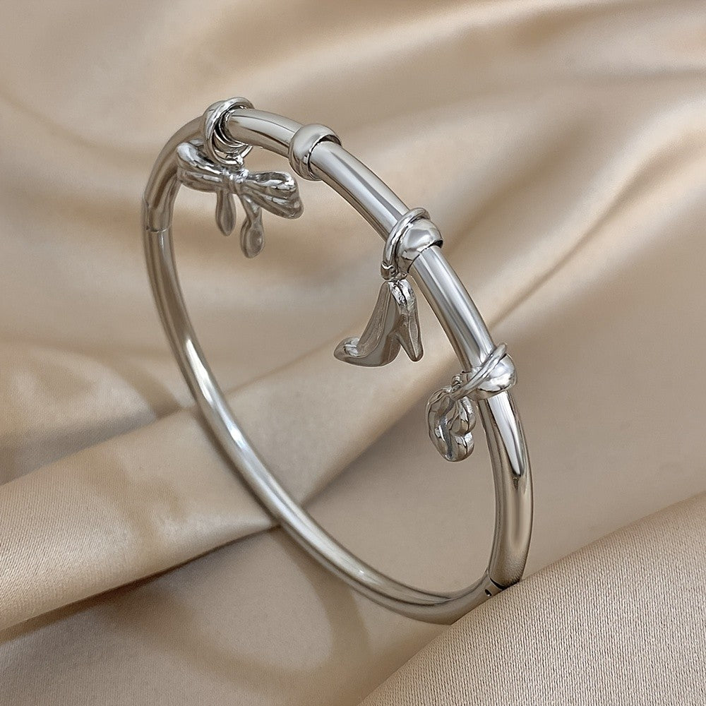 Charm Bangle with Bow and Heel Pendants