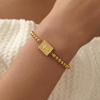 18k Beaded Cross Locket Bracelet